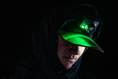 Man in Hat Uses Green LED from Headlamp At Night, lifestyle photo