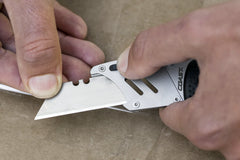 Stainless Steel Folding Utility Knife using E-Z Blade replacement system to switch out dull blade, lifestyle photo.